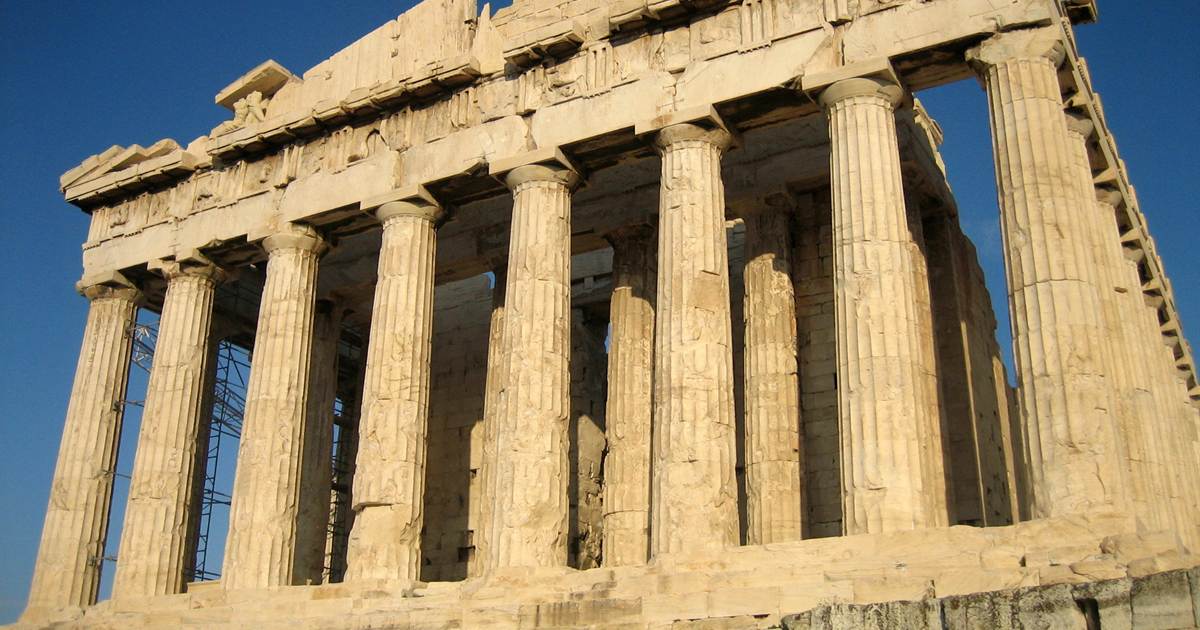 The Parthenon temple on the Acropolis of Athens under a clear blue sky.
